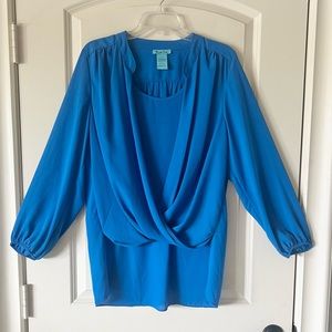 Blue Blouse with draped opening, built in tank, and high low hem
